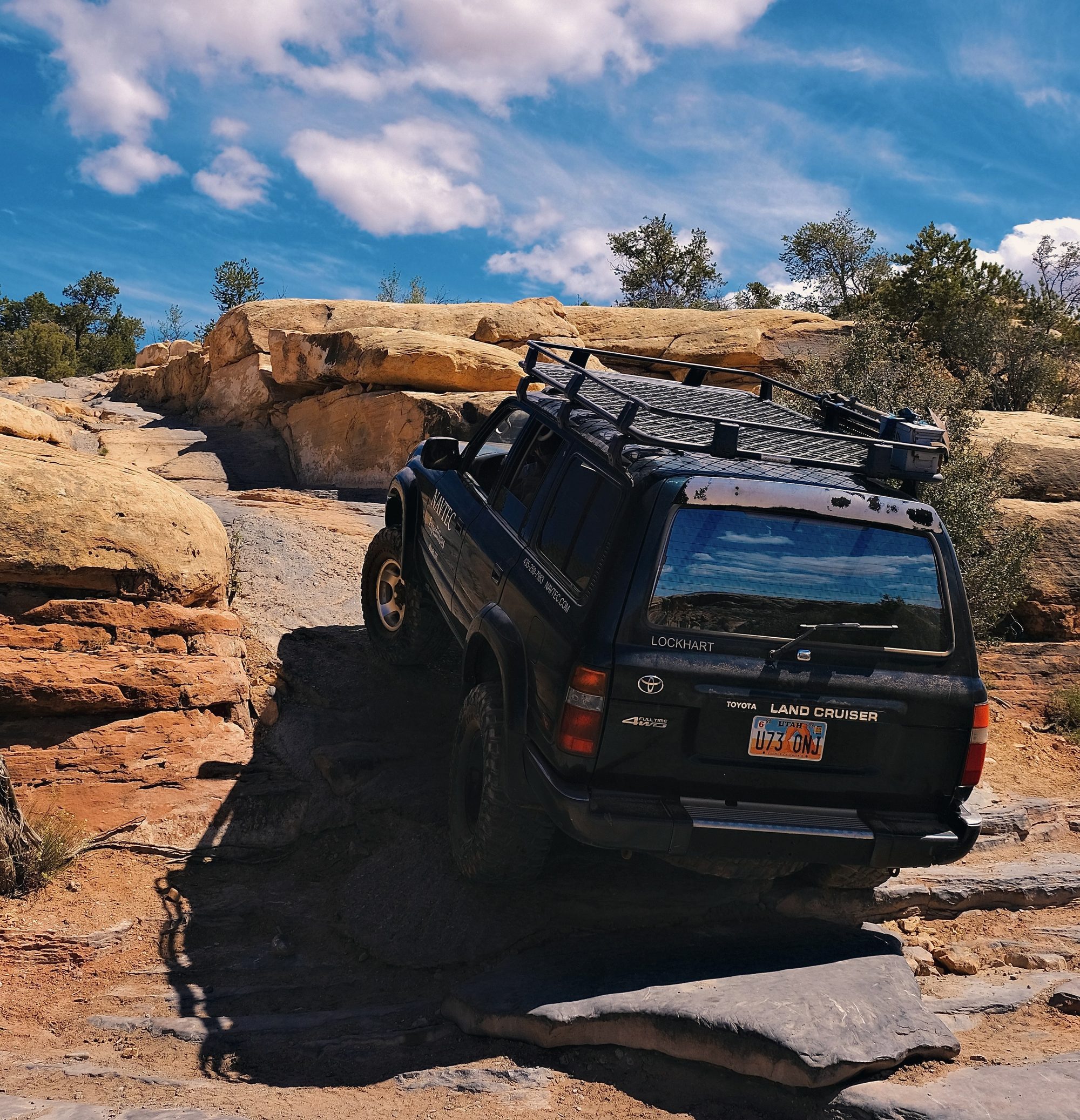 A NAVTEC 4x4 Land Cruiser on a backcountry trail in a national park near Moab