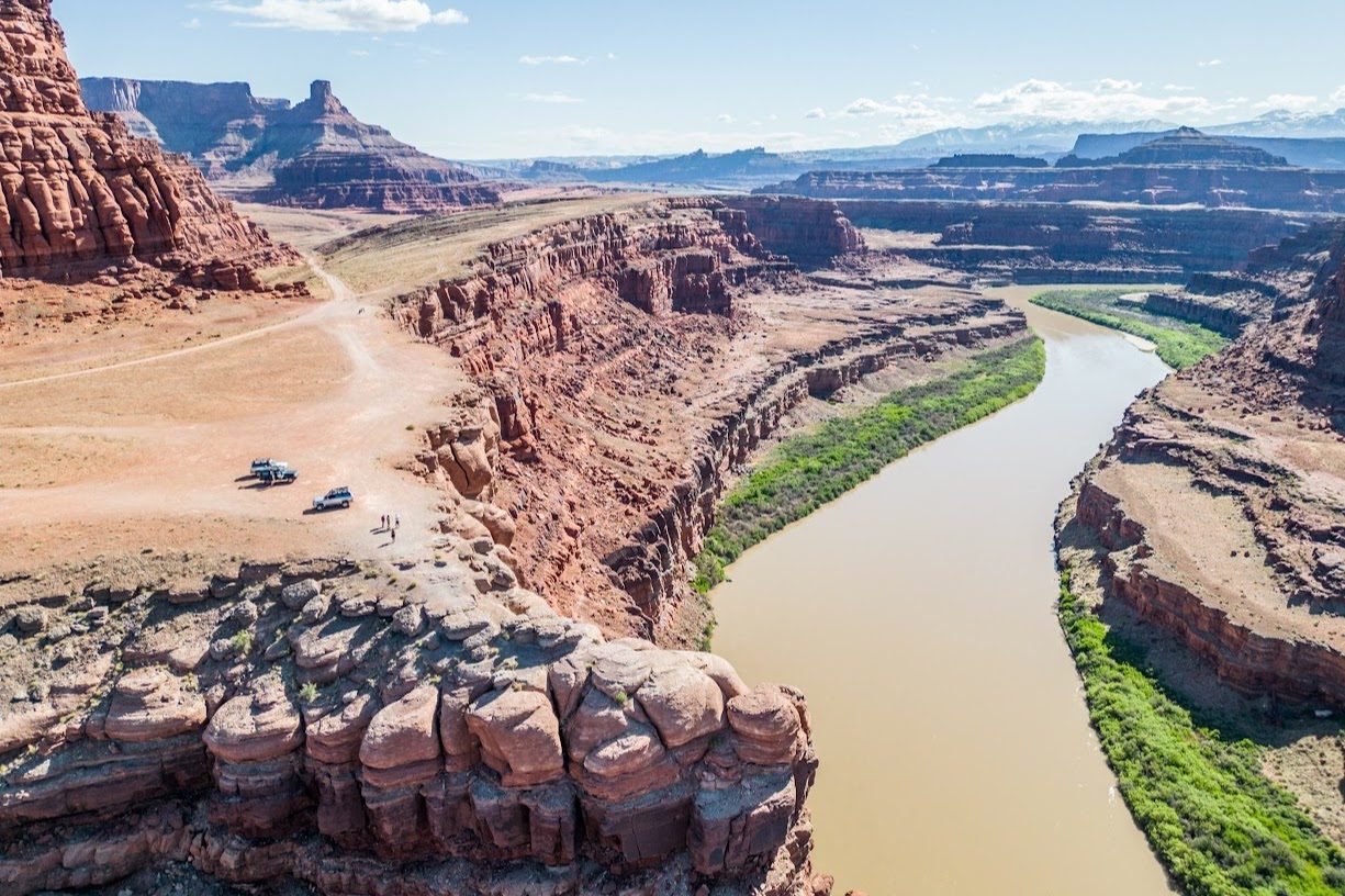 Aerial view of a calm bend in the Colorado River through red rock canyon
